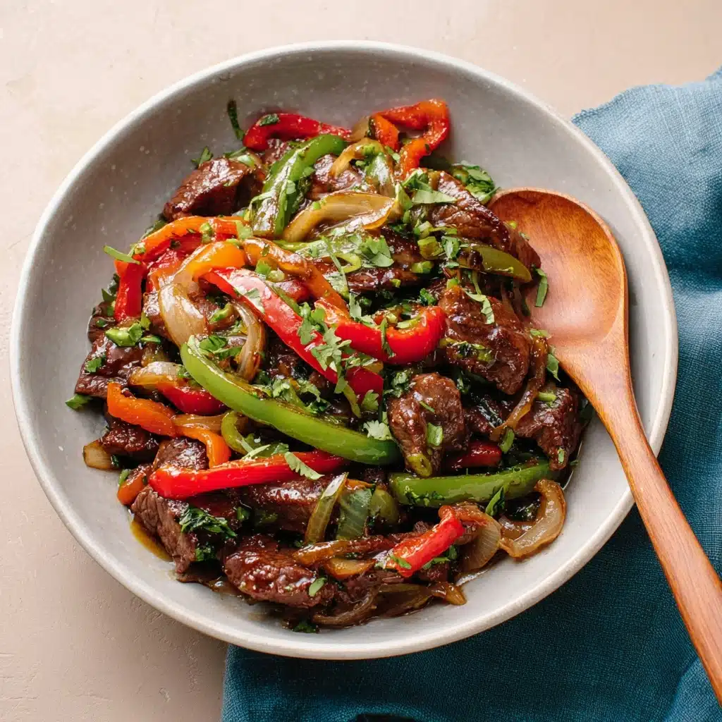 A bowl of stir-fried beef and bell peppers dish featuring succulent brown beef slices cooked to a slight char, mixed evenly with vibrant red and green bell pepper strips, and translucent sautéed onions adding a light texture contrast. The dish is garnished with fresh green herbs finely chopped and sprinkled on top for a pop of color, all glistening slightly in a glossy sauce coating each ingredient. The bowl is light gray, round, and smooth with a simple wooden spoon resting on the right side, placed over a muted blue cloth on a neutral beige surface. photo taken with an iphone  --v 7.0