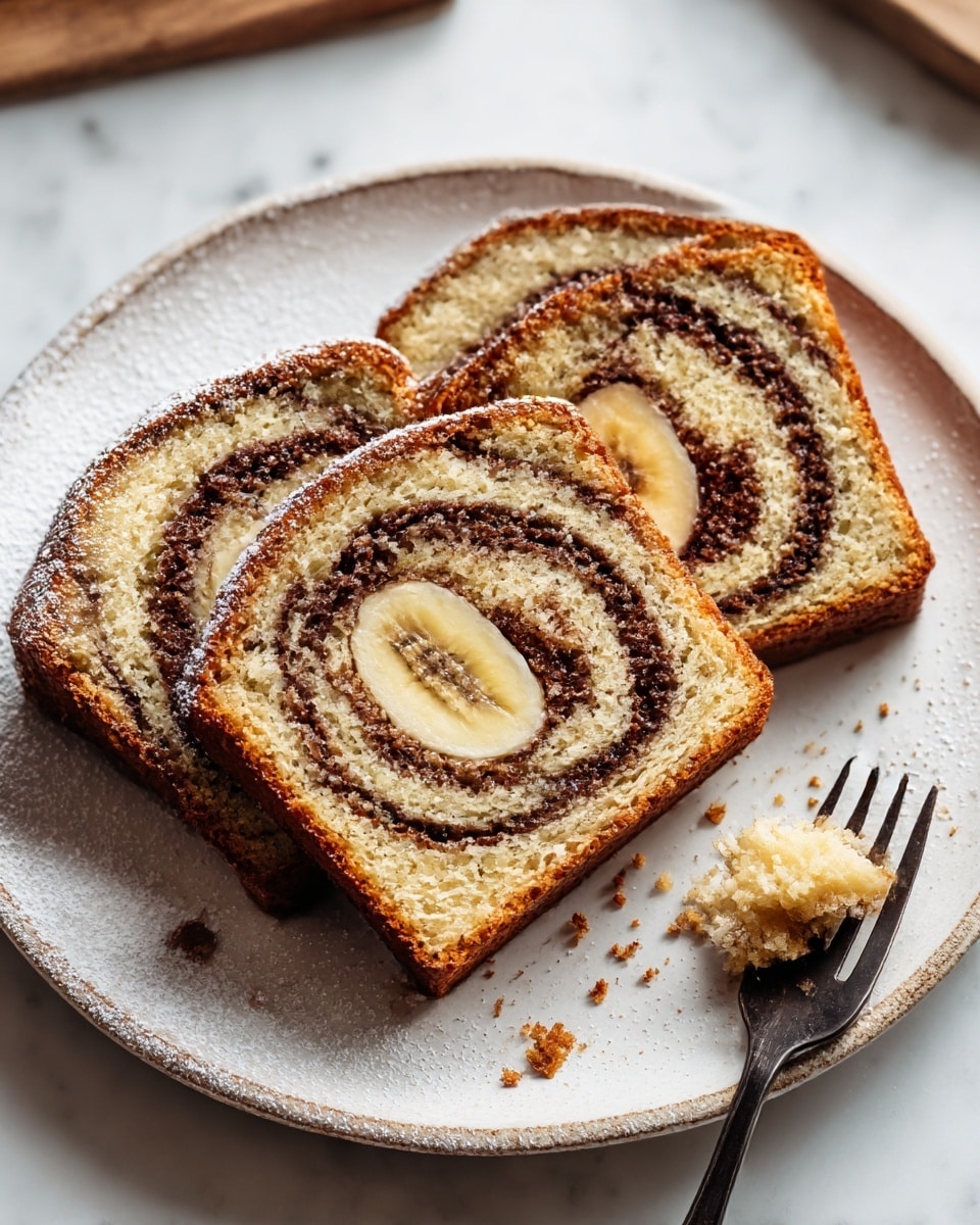 The image shows three thick slices of banana swirl bread on a white plate, each slice featuring a distinct spiral pattern. The bread has a golden-brown crust on the outside with a soft, light beige inner texture, and a darker brown swirl running through the middle, tracing a spiral from the center to the edges. In the center of each slice, there is a visible round banana piece with its pale yellow inside and tiny brown seeds. The surface of the bread is lightly dusted with powdered sugar, adding a soft white contrast to the warm tones of the bread. A silver fork holds a small crumb of the bread on the right side of the plate. The scene is set on a white marbled background with soft natural light coming from a window in the background. Photo taken with an iphone --ar 4:5 --v 7